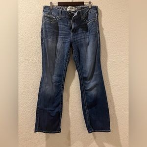 R.E.A.L. Mid Rise Stretch Entwined Boot Cut Jean